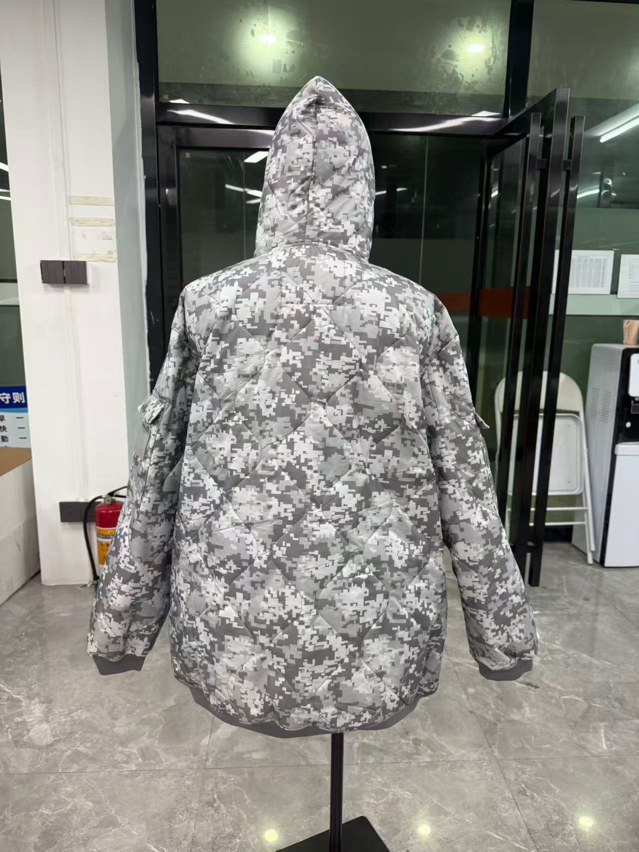 Camouflage hoodie shown from the back view.