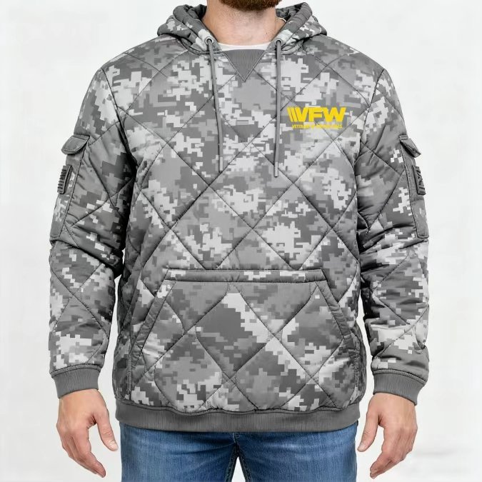 Camouflage hoodie with a woobie stitching pattern, kangaroo style pocket in front with Velcro flap arm pockets on both sides and VFW logo in yellow on chest.